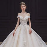 Luxury Off-Shoulder Wedding Dress - Handmade Lace Ball Gown | Femstylo